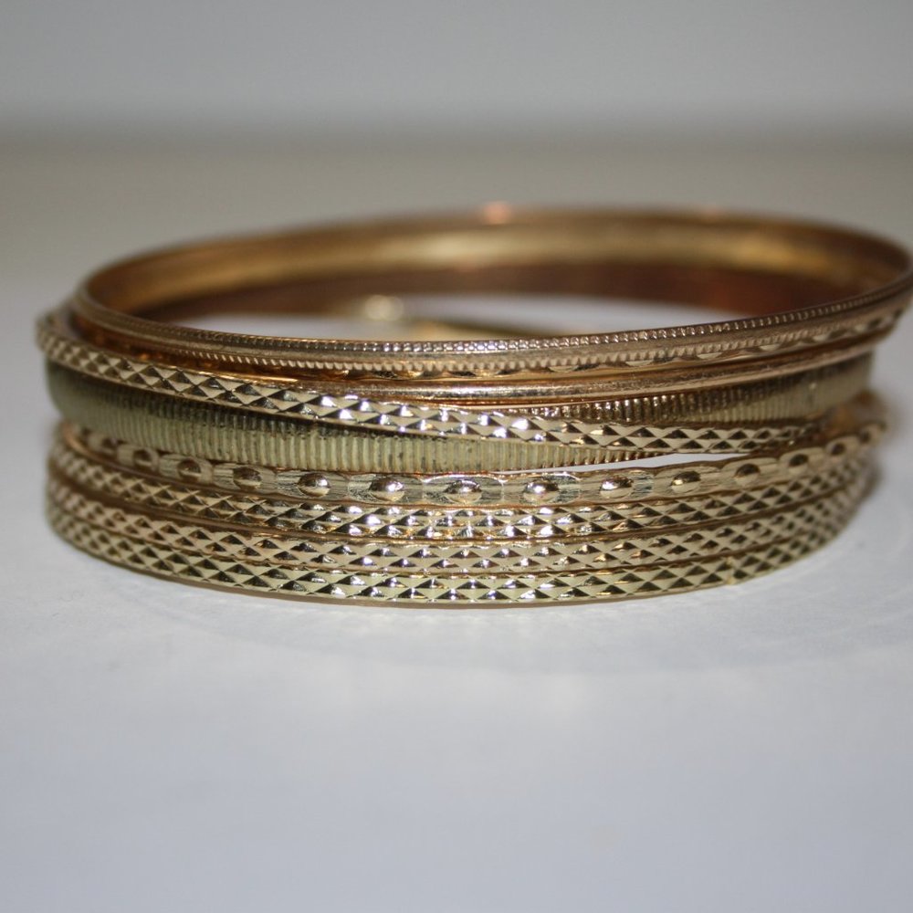Beautiful gold bracelet bangle set of 9 for larger wrist 3" wide